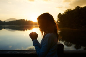 woman-praying-profile-featured-w740x493